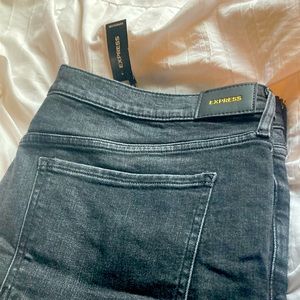 Black express jeans, ripped bottom hem. Never worn, new with tags. Size 18R